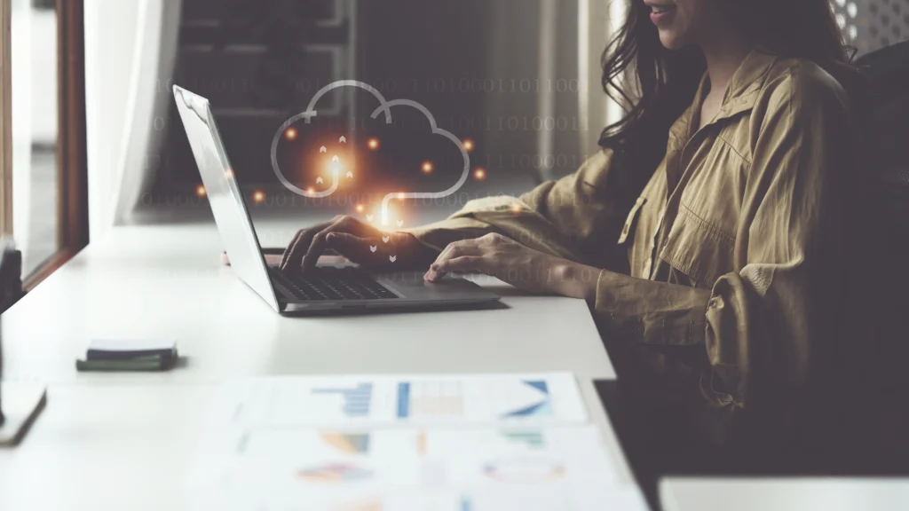Small business employee using cloud technology to access flexible, cost-effective solutions for growth, leveraging cloud systems for better data-driven insights and business success with help from Scorpion Five Technologies.