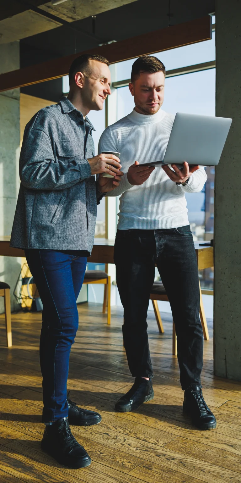 A business analyst from Scorpion Five Technologies shows a client the strategic technology roadmap, representing what can be created by using a structured business analysis approach.