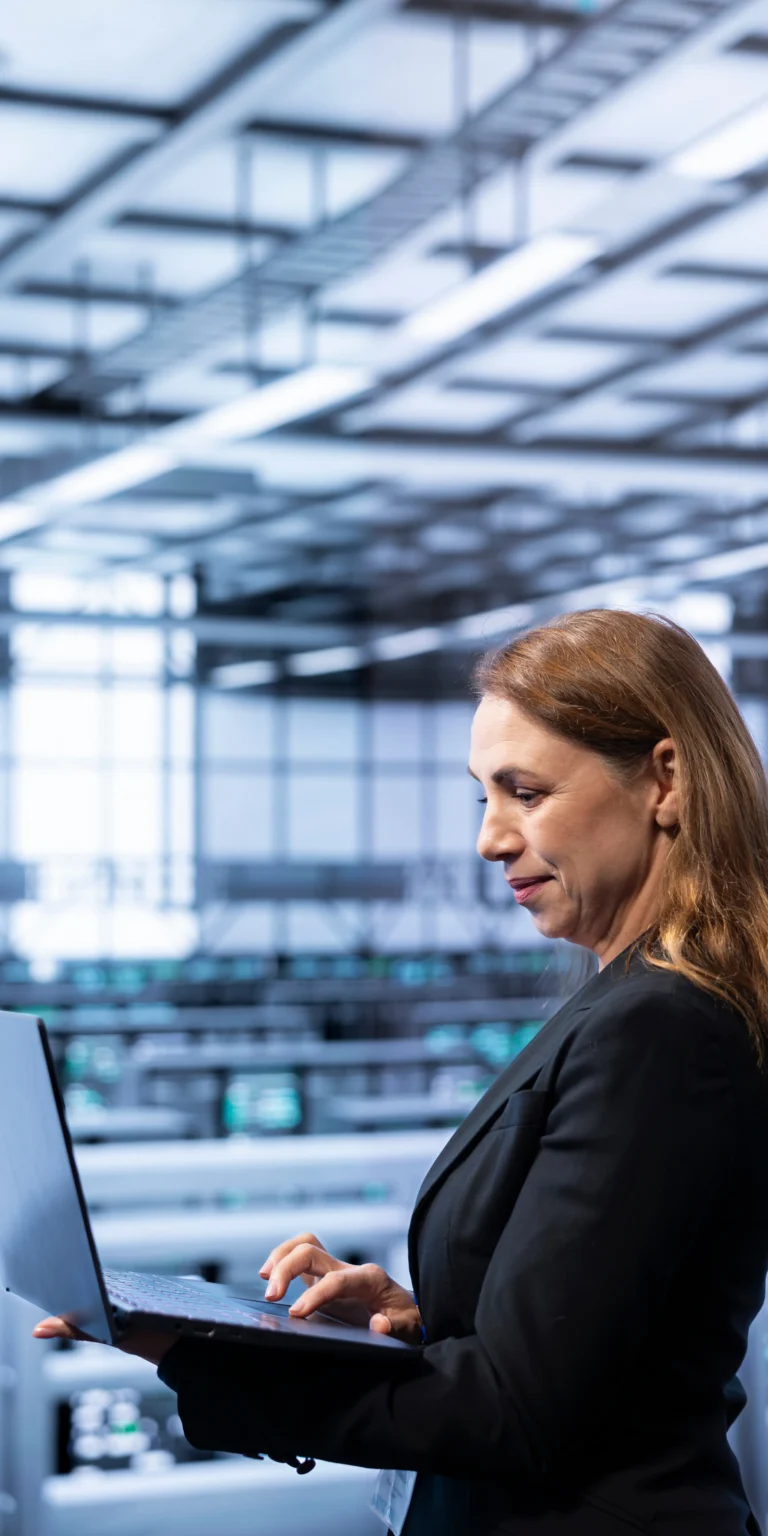 Cybersecurity professional auditing infrastructure from a secure operations center—highlighting how Scorpion Five Technologies (S5T) supports compliance through proactive, accreditation-ready system design.