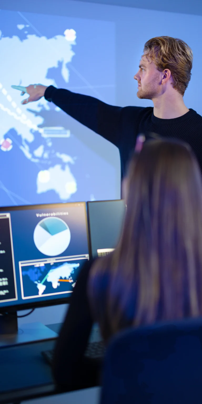 Analyst presenting spatial intelligence on a digital map—illustrating how Scorpion Five Technologies delivers GIS development solutions for mission-critical analysis and situational awareness.