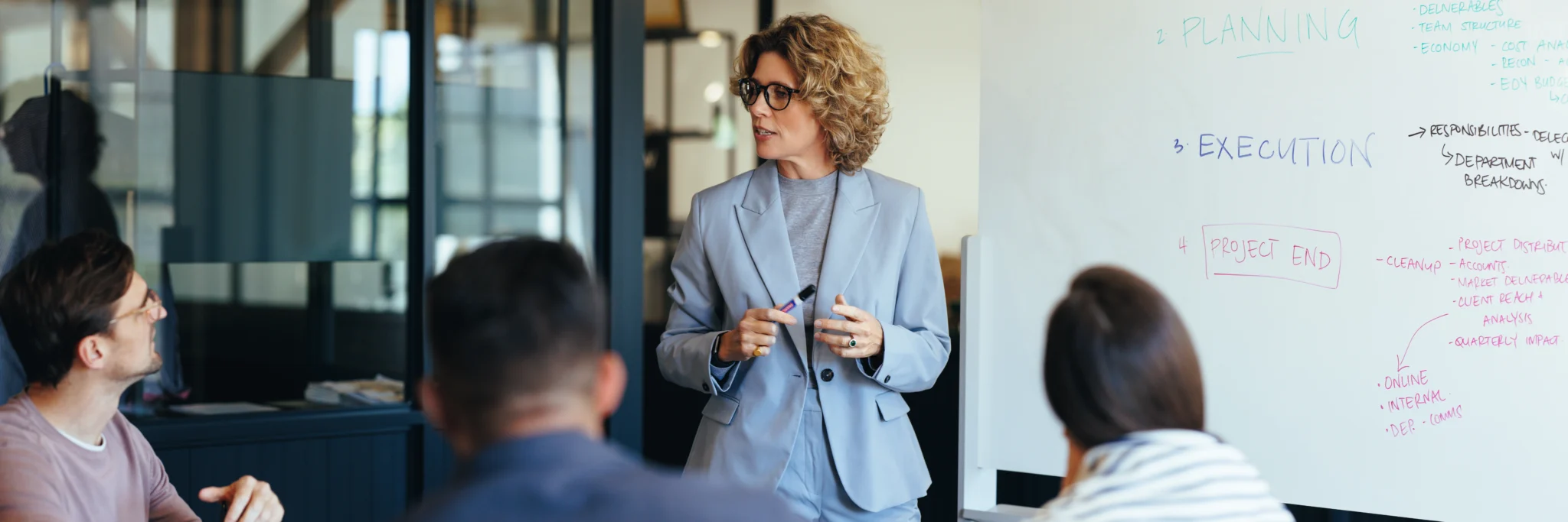 Project leader guiding a modernization strategy session—illustrating how Scorpion Five Technologies (S5T) delivers measured, phased legacy system modernization for large organizations and government agencies.