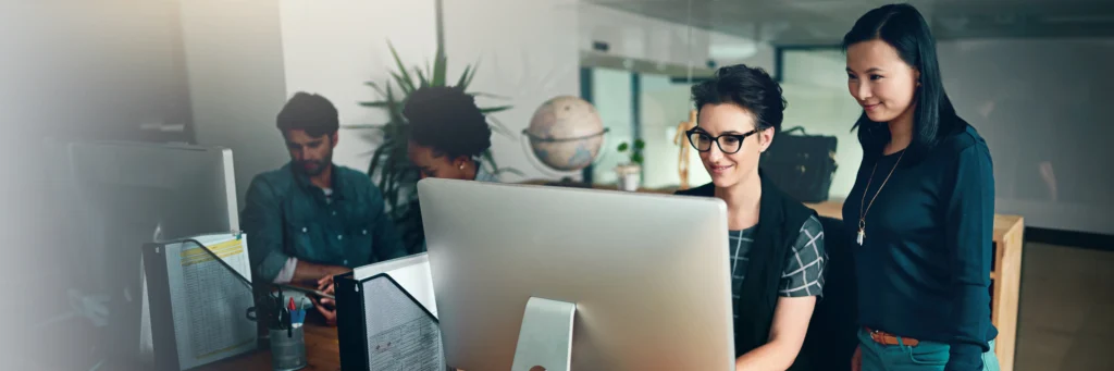 Small business team collaborating on website content—showcasing how Scorpion Five Technologies delivers professional web development services that drive engagement and growth.