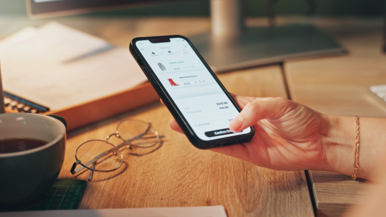 User interacting with a mobile eCommerce app on a smartphone—illustrating how small business technology leverages custom mobile applications to drive online orders, improve user experience, and enable new leads through mobile-friendly platforms.