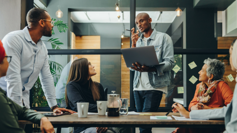 Team collaborating during a planning session, representing the small business software development phase of requirements analysis—defining goals, gathering user input, and aligning business processes before custom software development begins.