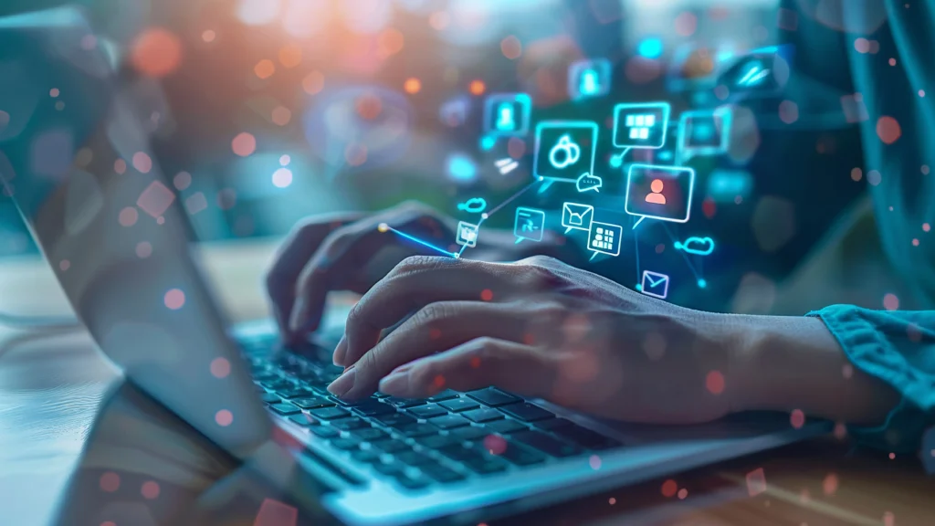 Hands typing on laptop with digital icons representing website, content, email, and social media—illustrating the key components of an online presence for small businesses.